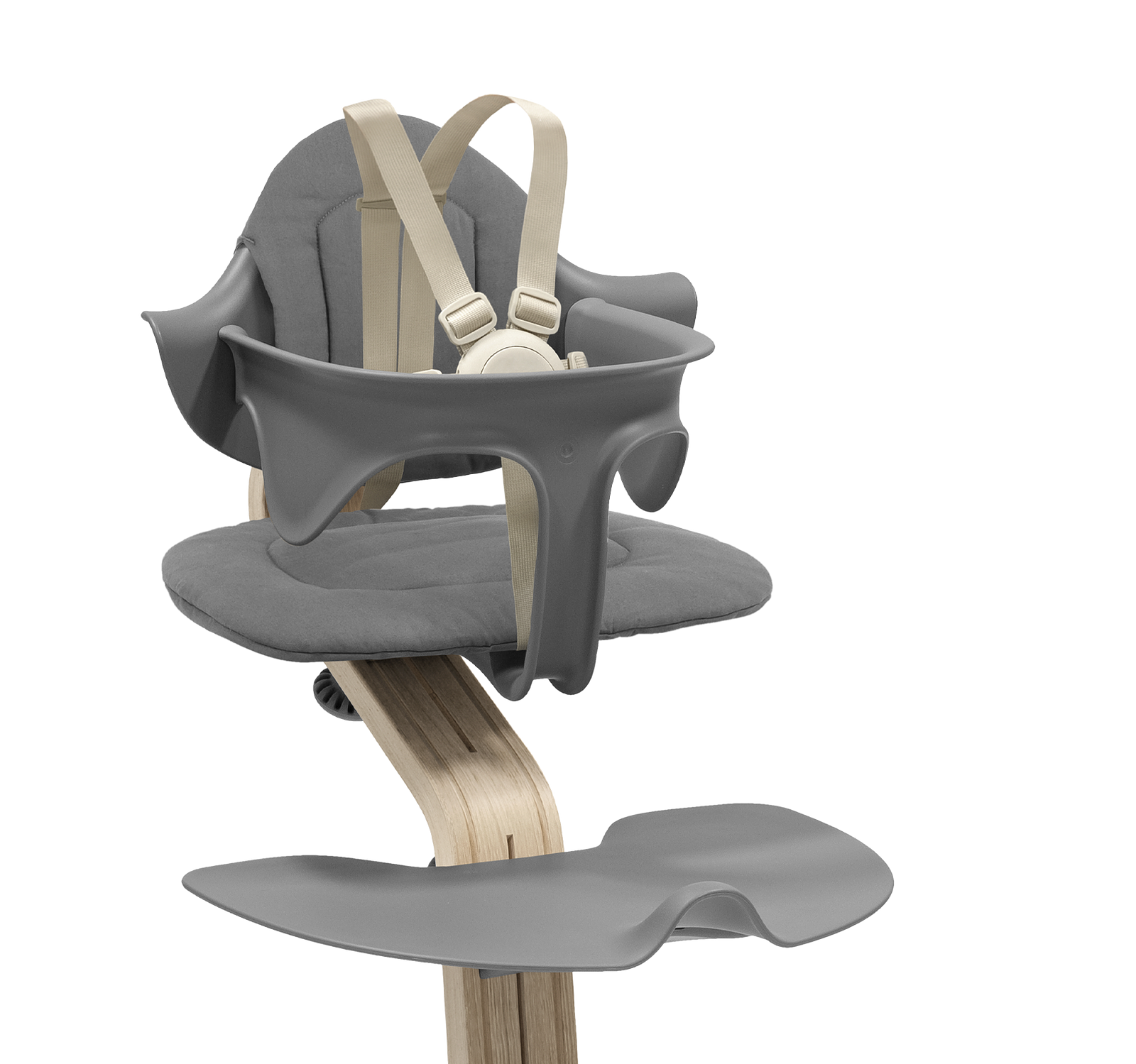 Tripp Trapp high chair with grey Baby Set and cushion on a white background.