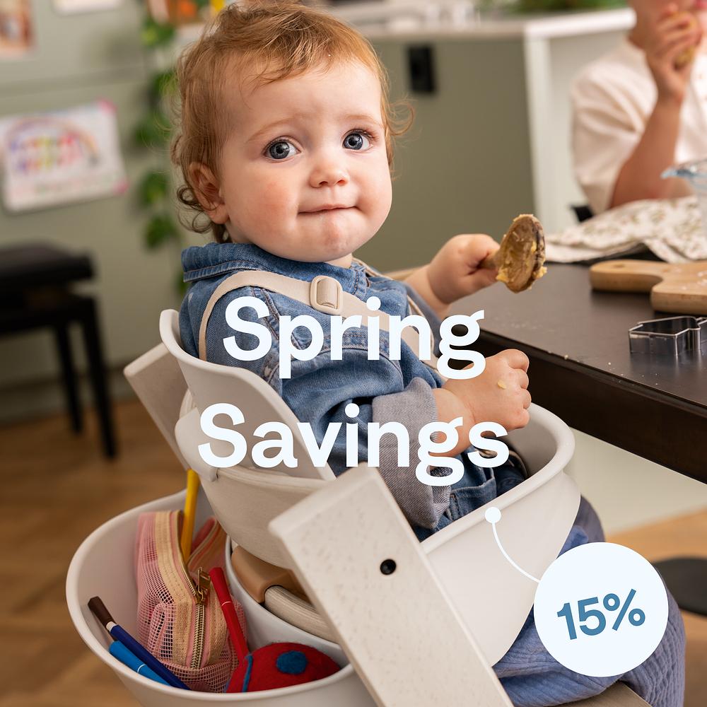 Baby sitting in tripp trapp high chair. Spring travel savings 15%.