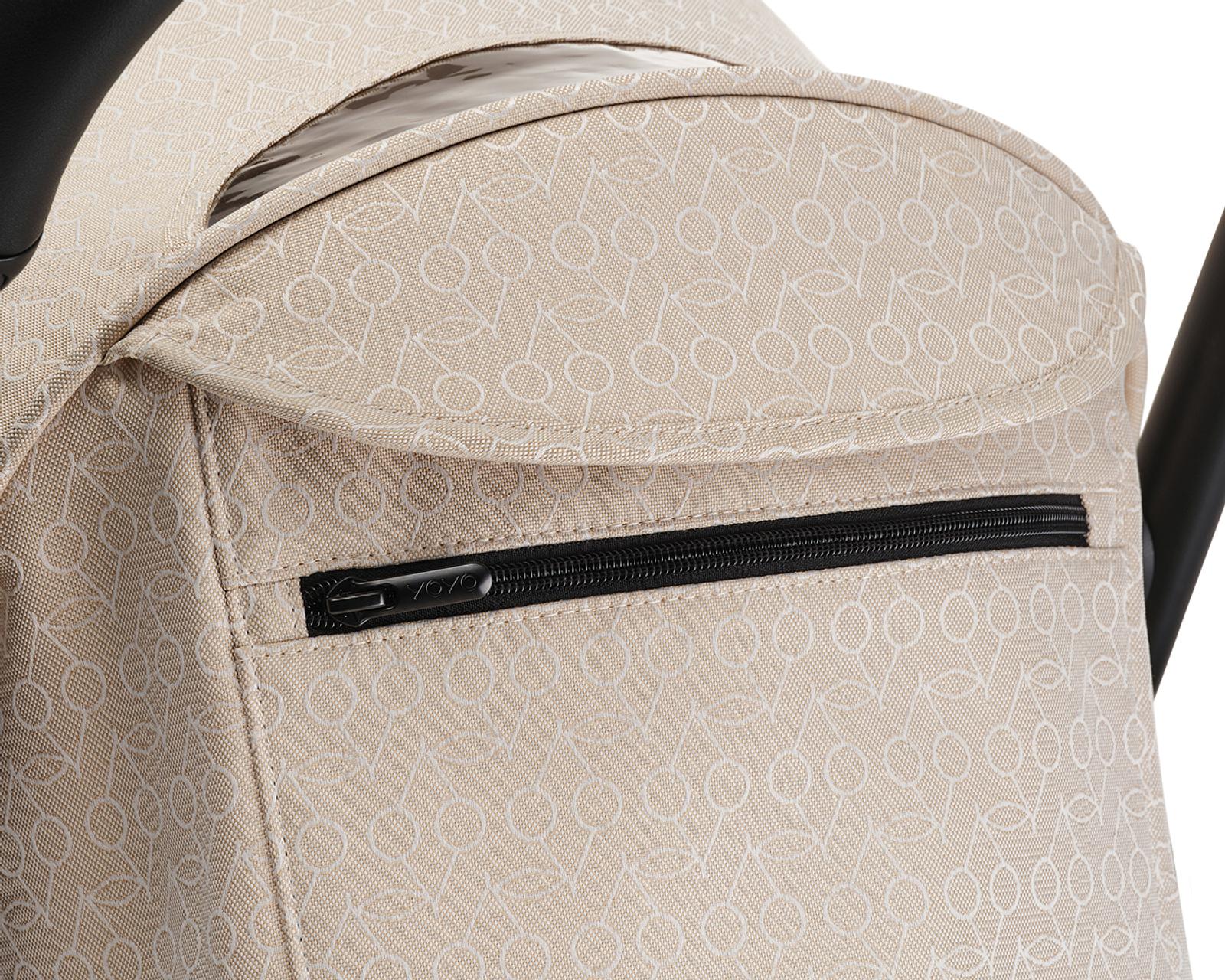 STOKKE YOYO stroller canopy with beige cherry pattern and black zipper.