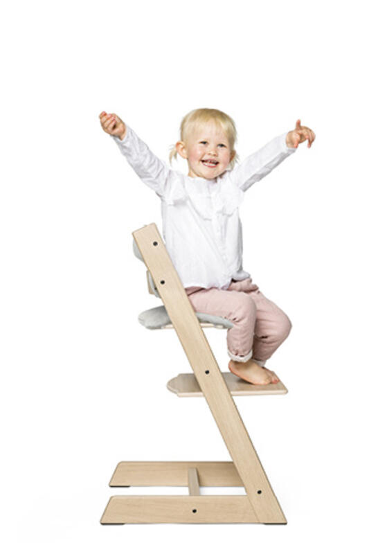 child on tripp trapp chair with cushion