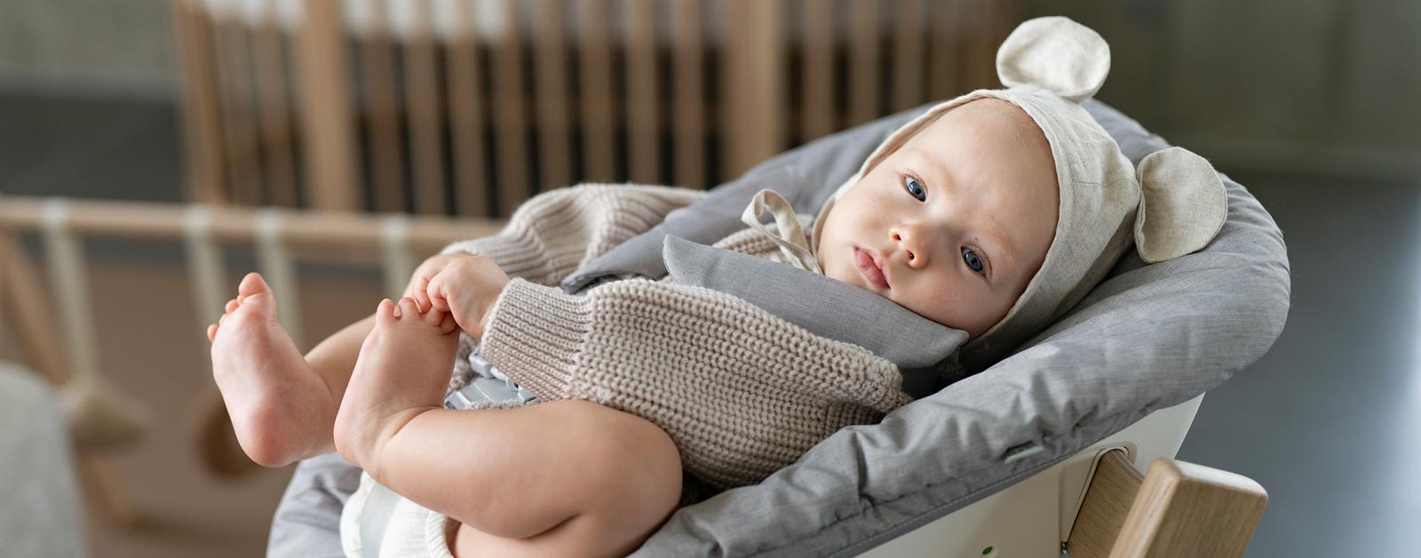 Baby in Tripp Trapp newborn set high chair.