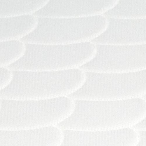 White sleepi mini mattress closeup scallop pattern.