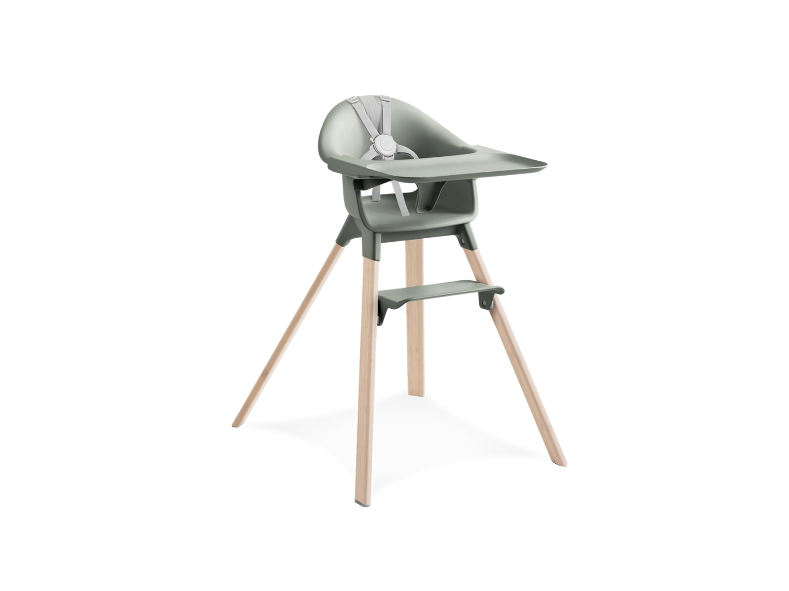 A sage green high chair with a tray and footrest, supported by light wooden splayed legs.