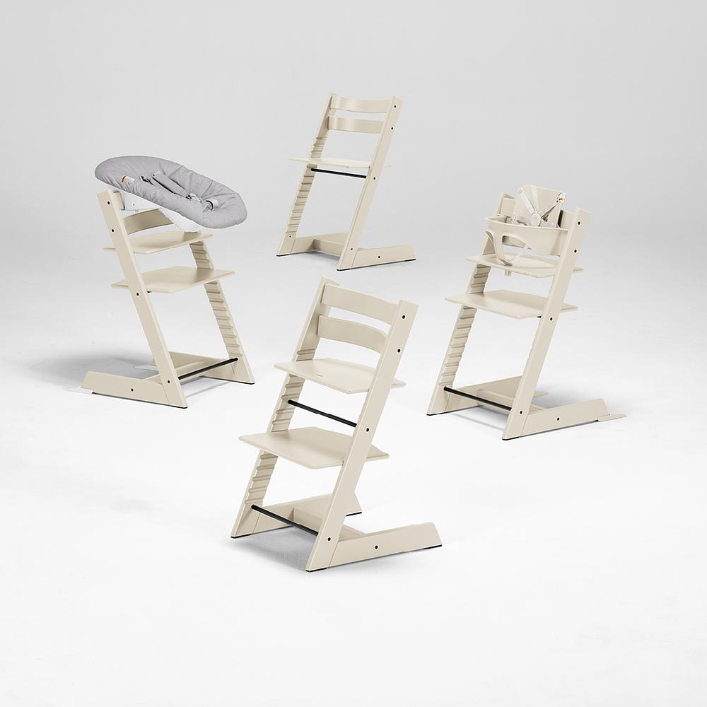 Image with four Tripp Trapp Chair Vanilla White with different accessories