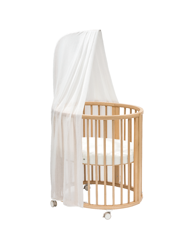 Sleepi Mini crib with canopy and mattress.