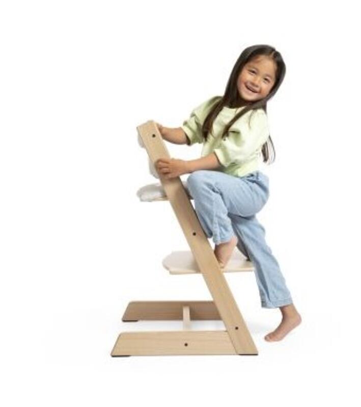 child on tripp trapp chair with cushion