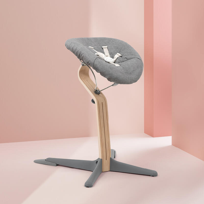 Product shot of Stokke® Nomi® chair with newborn set.
