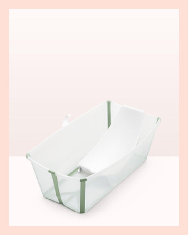 A flexi baby bath in color transparent green with newborn support.