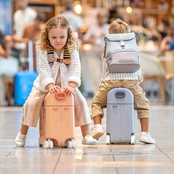 Kids riding their Bedboxes in the airport.