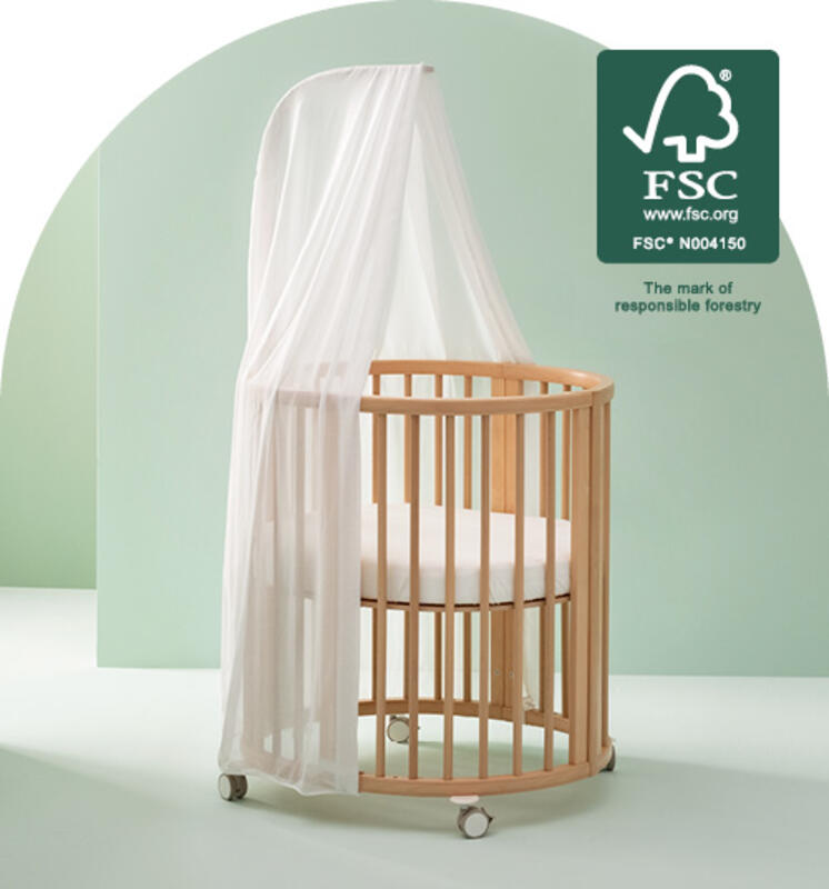 Sleepi mini crib in color natural with white canopy and mattress FSC certified.
