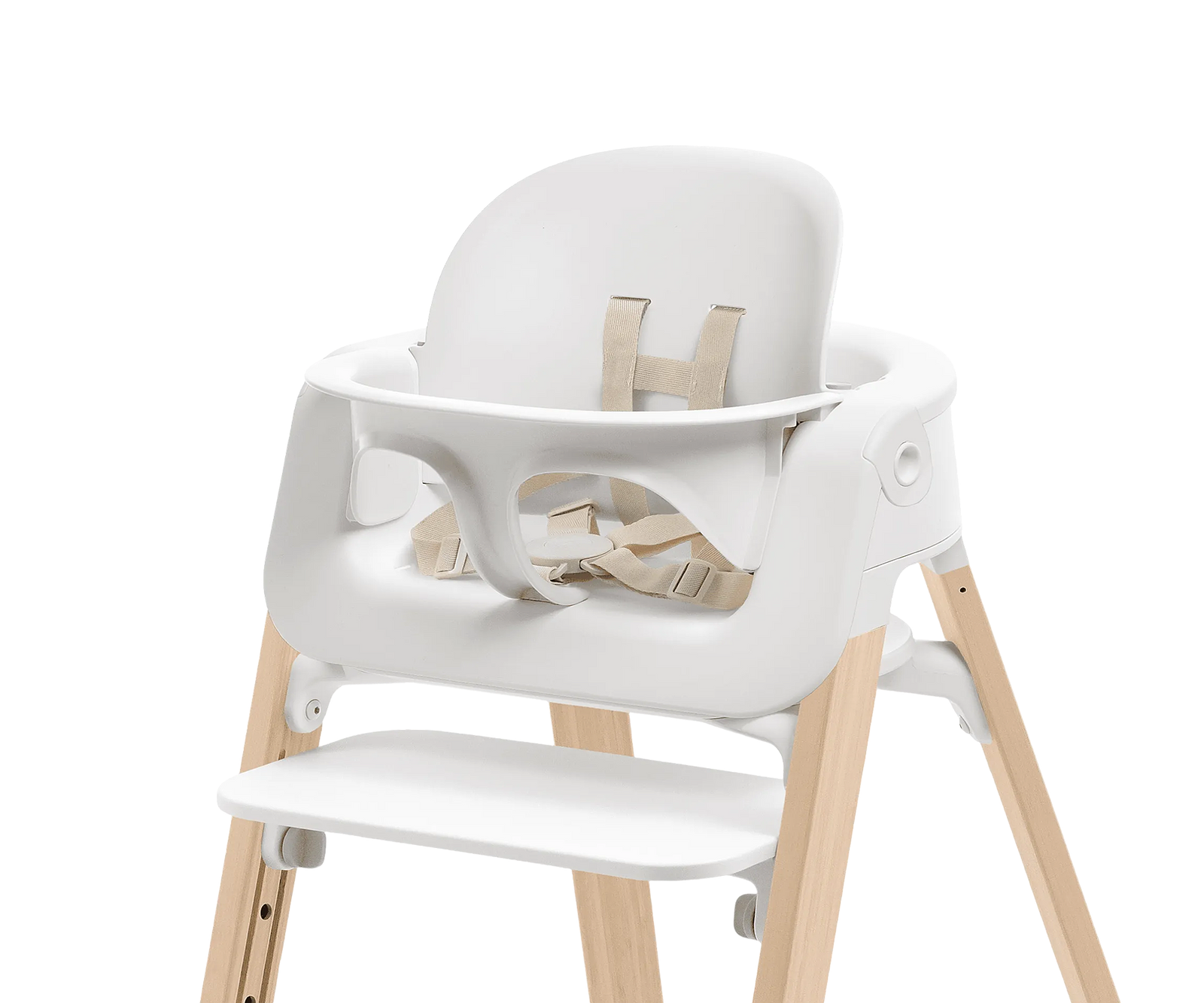 White high chair with natural wooden legs and a beige harness.
