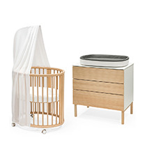 Sleepi mini bed crib in color natural with sleepi dresser with changer on top.