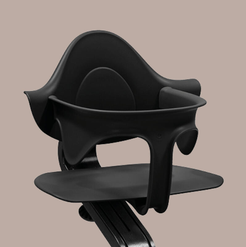 Closeup of Stokke® Nomi® Chair seat with baby set.