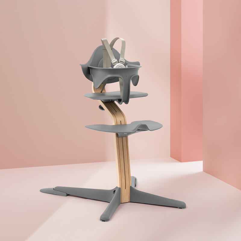 Product shot of Stokke® Nomi® chair with baby set.