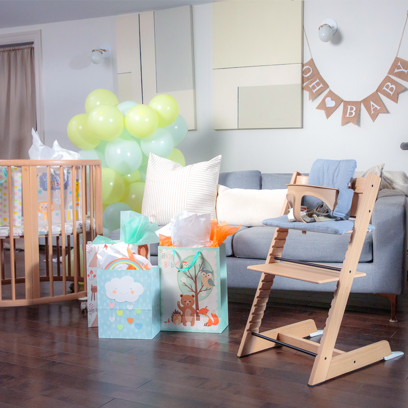Tripp Trapp® chair being gifted at a baby shower party.