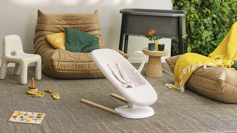 Stokke Yoga being showcased with the toy bar attachment