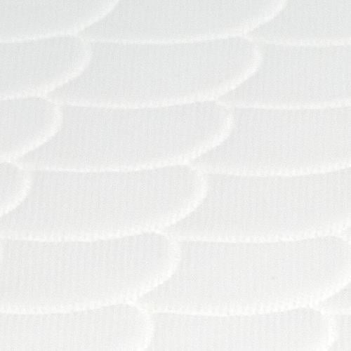 White sleepi mini mattress closeup scallop pattern.