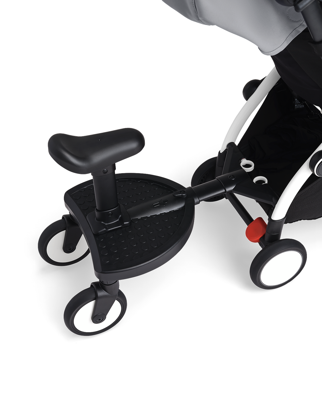 STOKKE YOYO stroller with a black rider board and seat attachment.