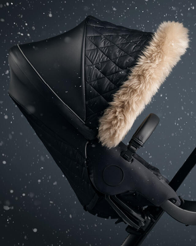 The insulated canopy and rear seat textile cover
