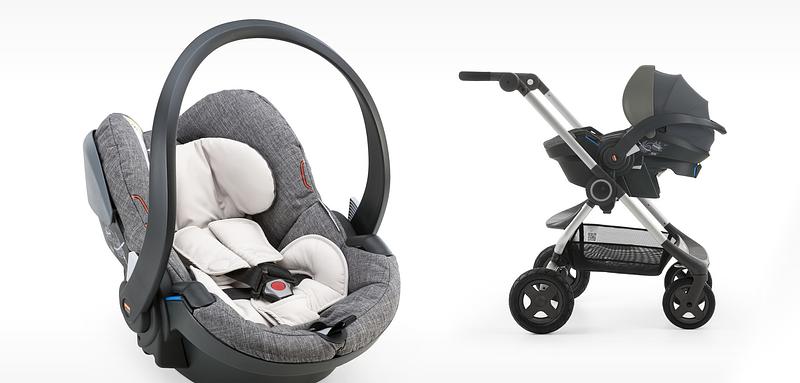 Mother with newborn in Stokke iZi Go Modular by BeSafe