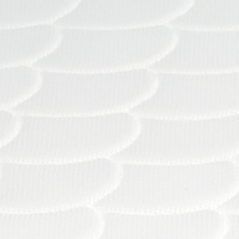 White sleepi mini mattress closeup scallop pattern.