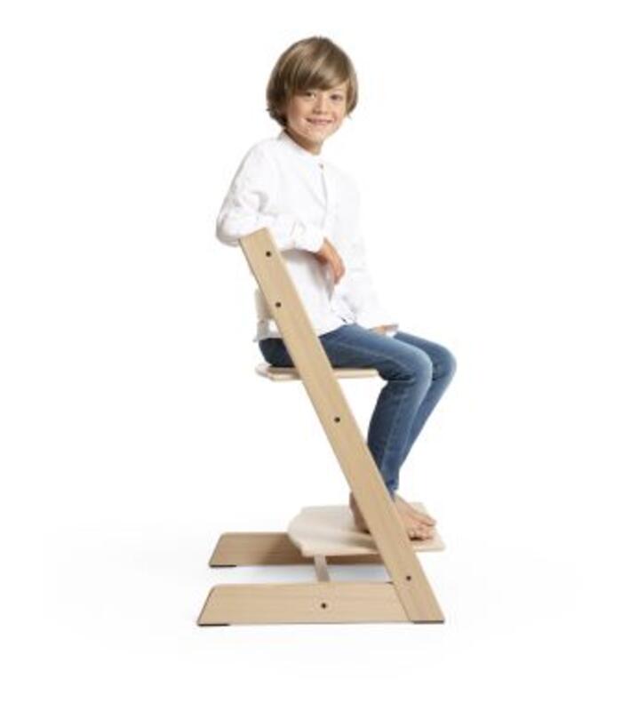 Kid sitting on tripp trapp chair
