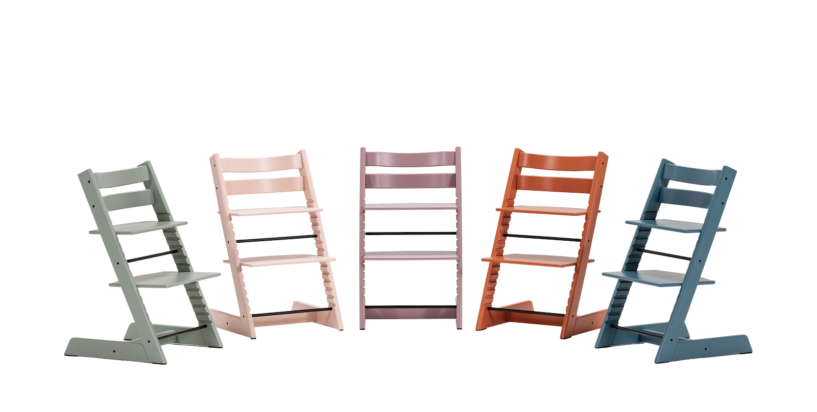 Five Tripp Trapp chairs in various colors: green, pink, lavender, orange, and blue.