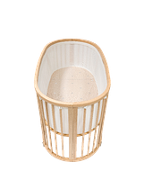 Sleepi crib with white mesh liner.