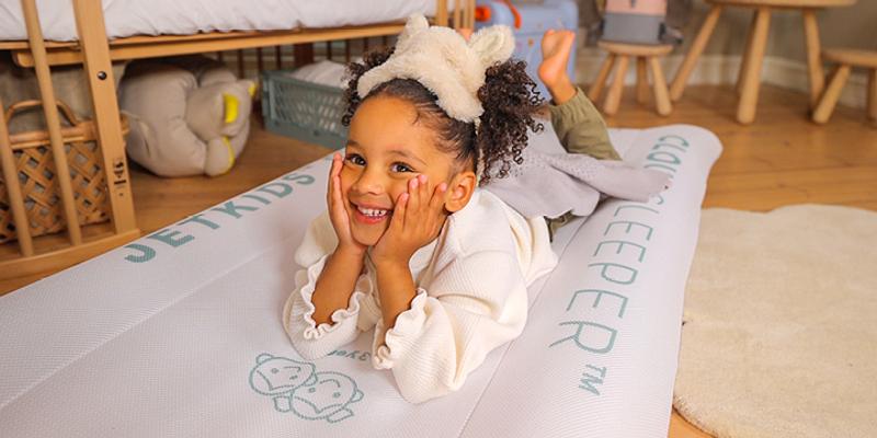 Little girl is laying on her JetKids Cloud Sleeper air mattress. Little girl is laying on her JetKids Cloud Sleeper air mattress.