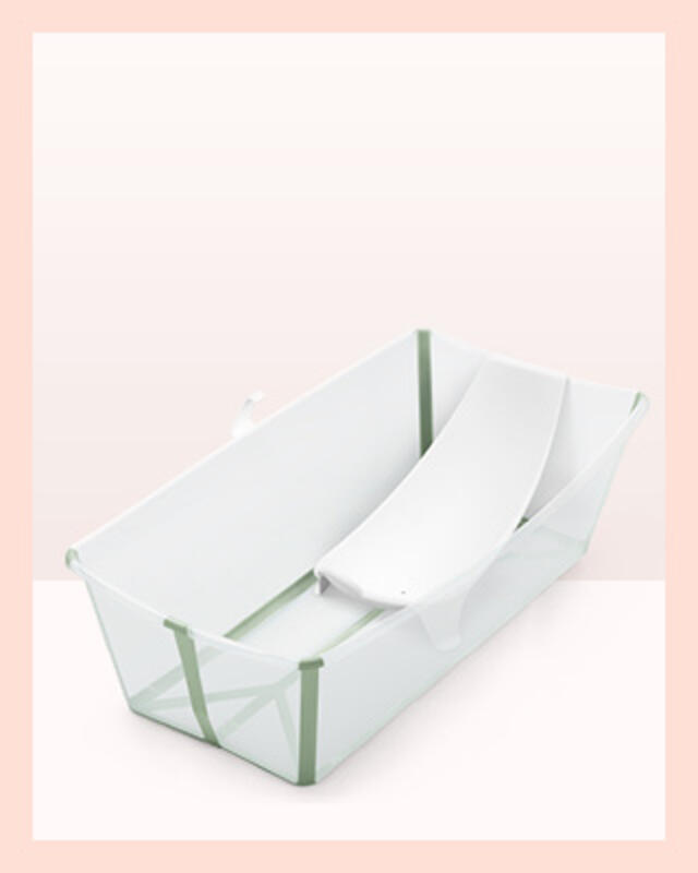 A flexi baby bath XL in color transparent green with newborn support.