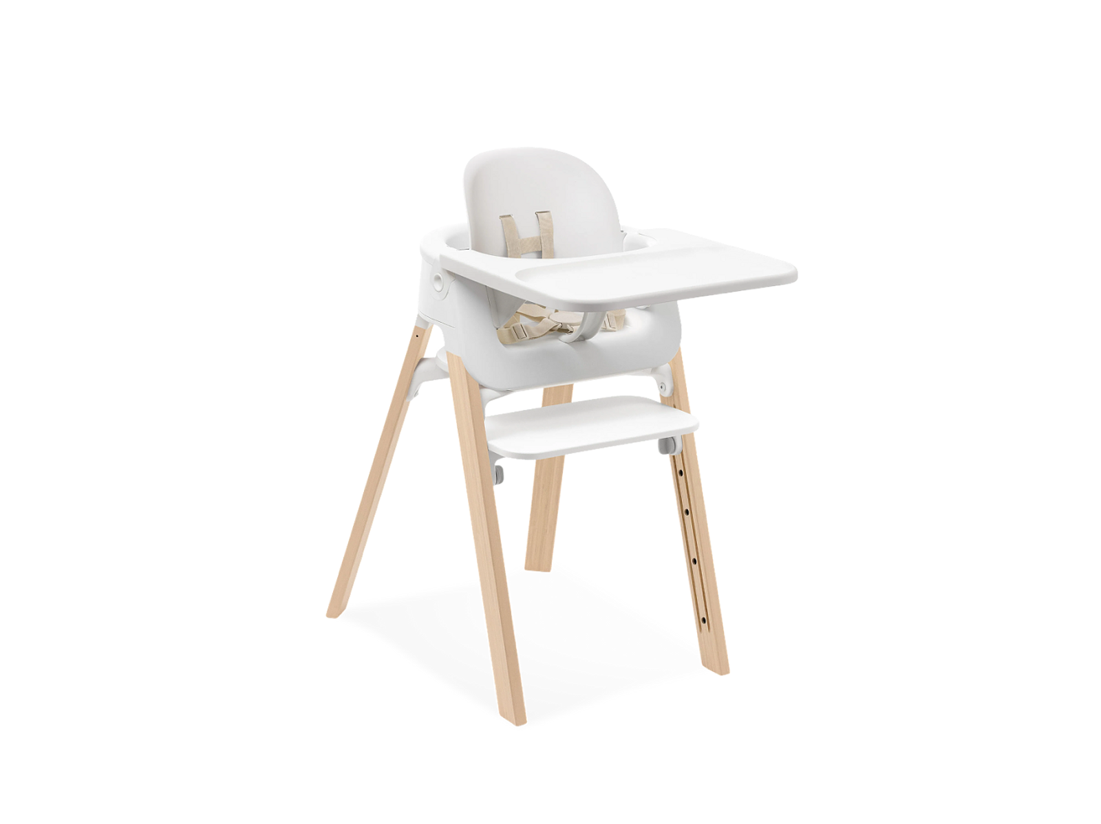 White high chair with a tray, seat, and natural wood legs.