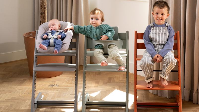Tripp trapp growline with a newborn, toddler, and child.