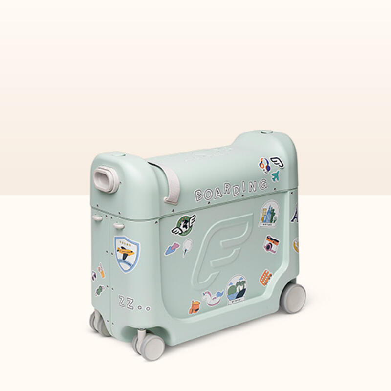 Jetkids by Stokke bedbox in color green aurora decorated with stickers.
