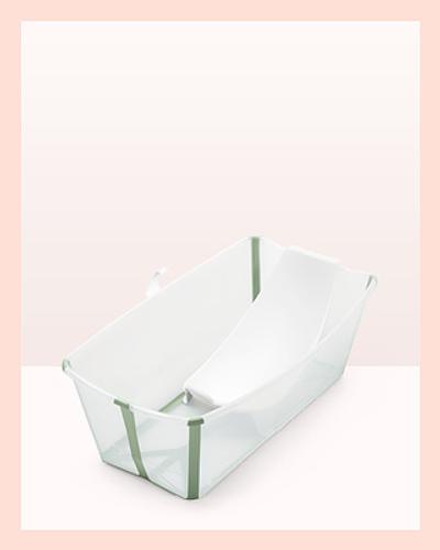 A flexi baby bath in color transparent green with newborn support.