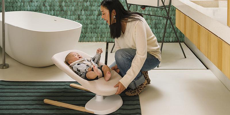 Yoga baby bouncer is placed securely on the flat bathroom floor