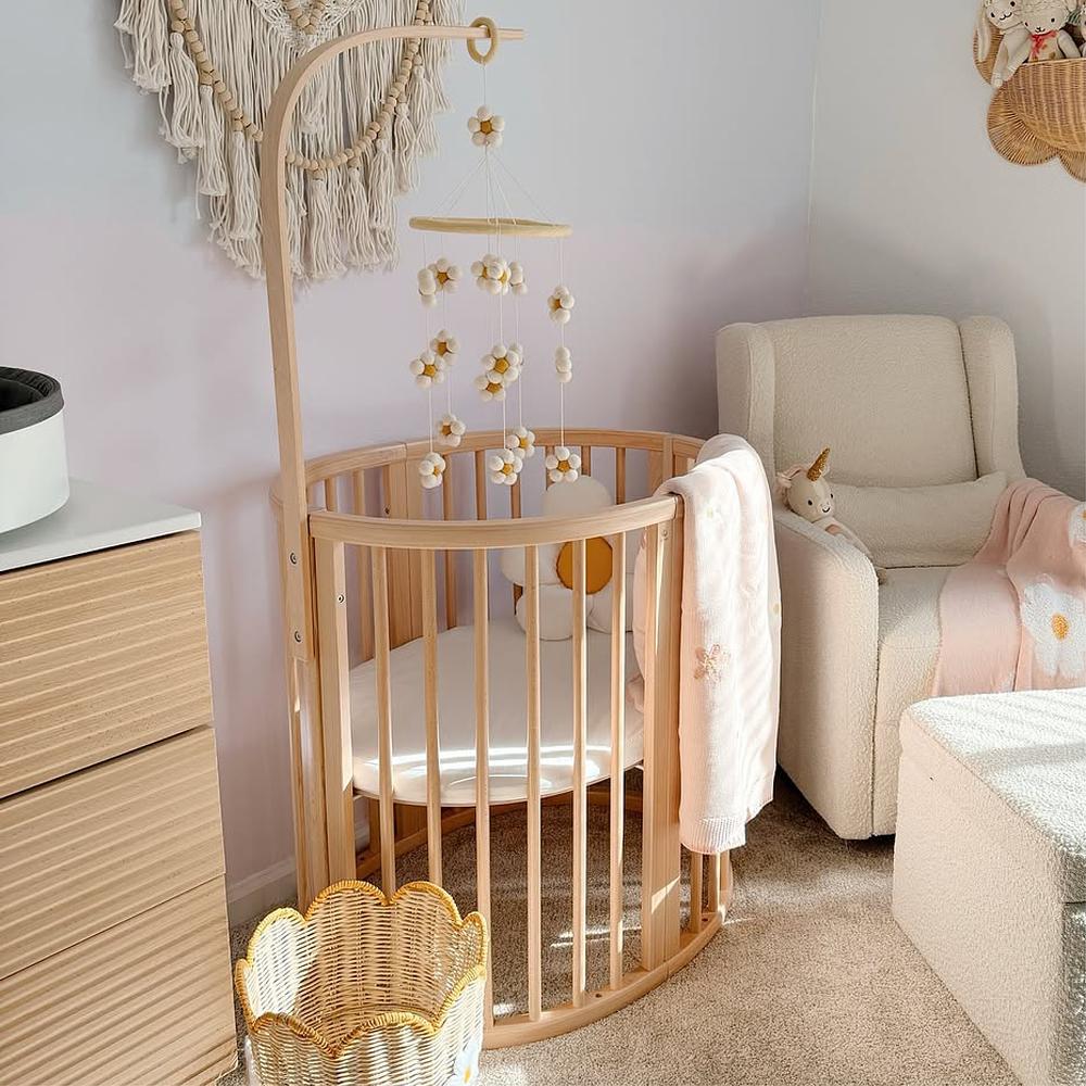 Baby nursery with sleepi mini crib.