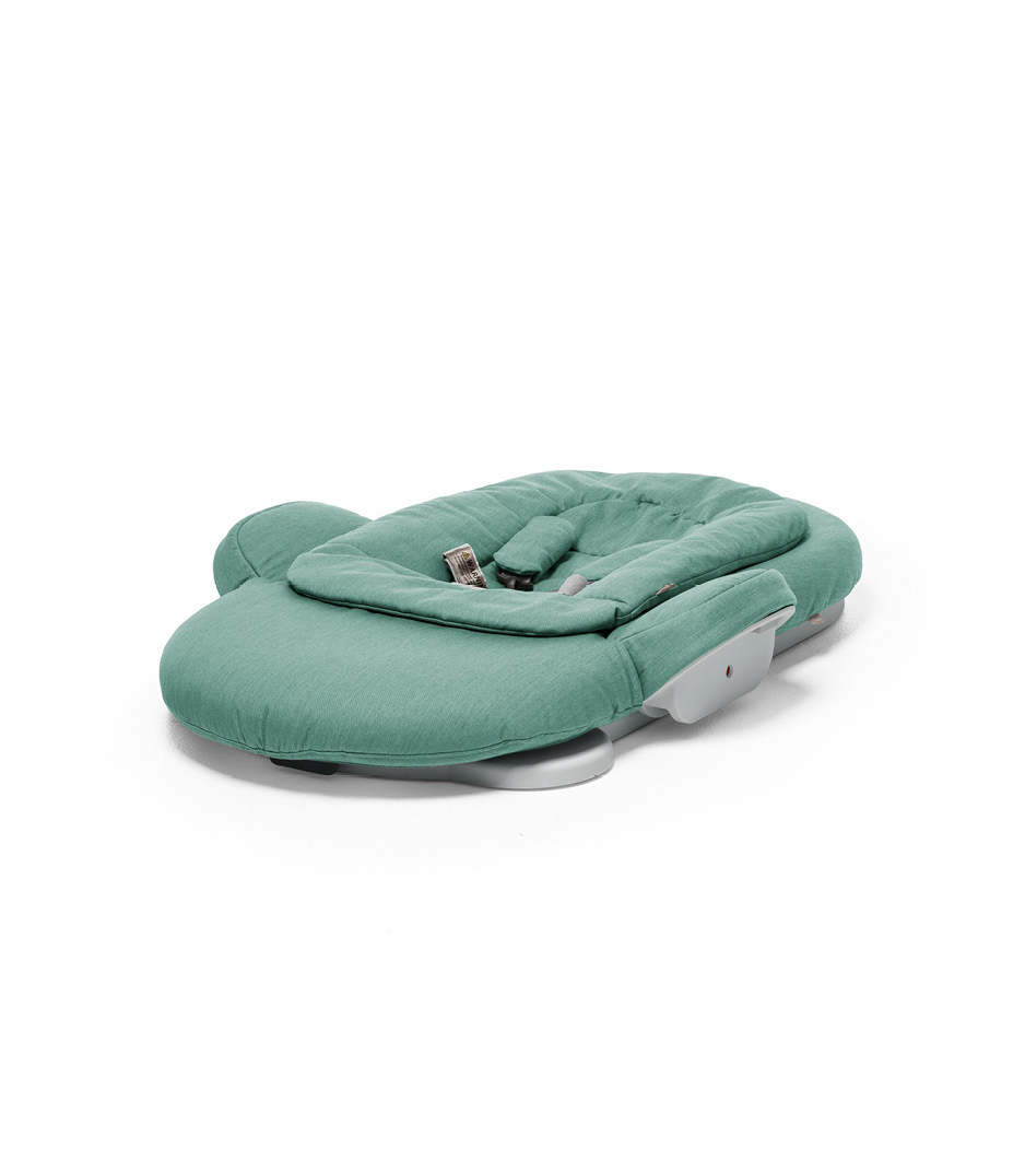 Stokke&reg; Steps Bouncer in Cool Jade. Folded.