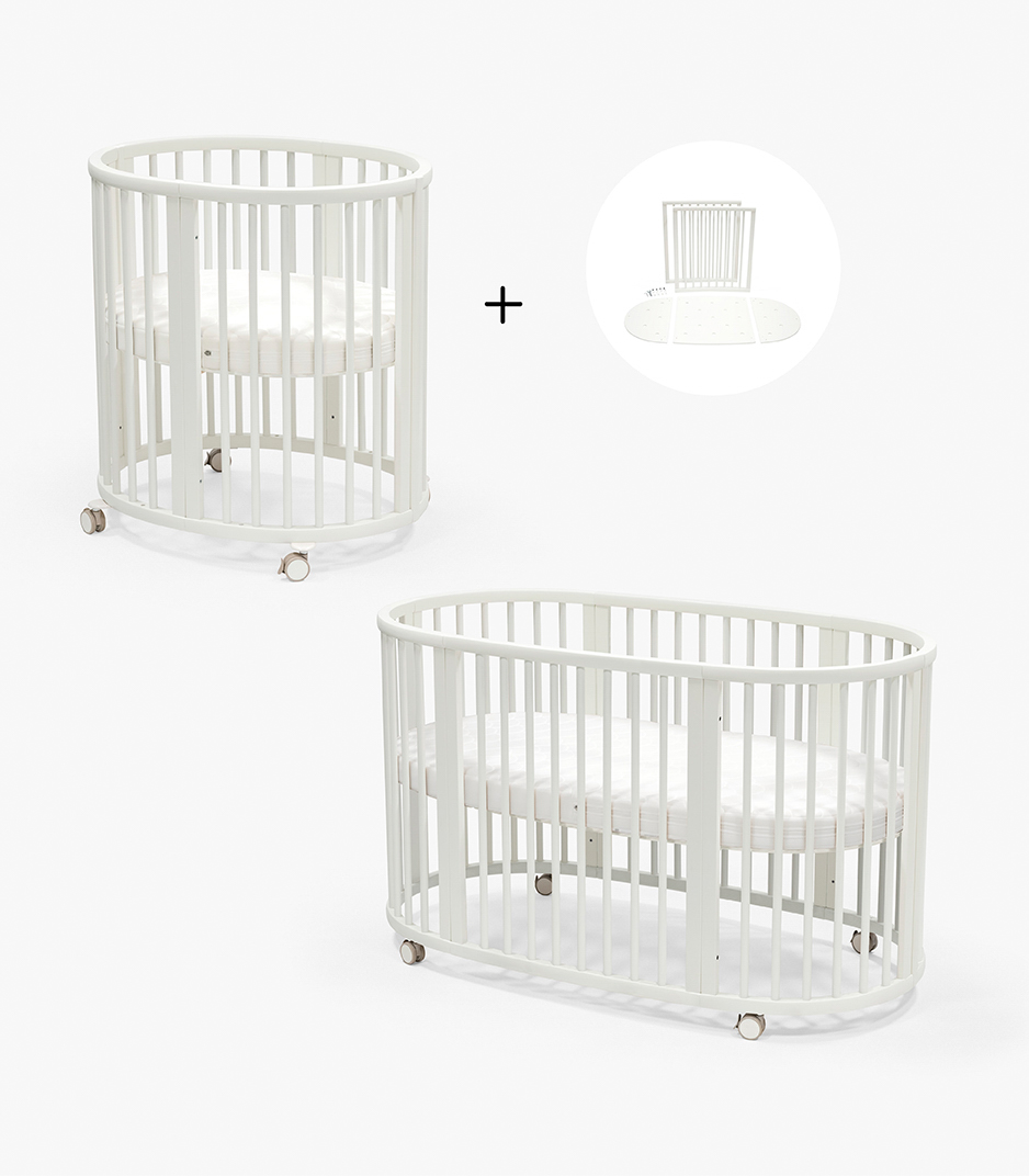White round crib with small circular motif and canopy